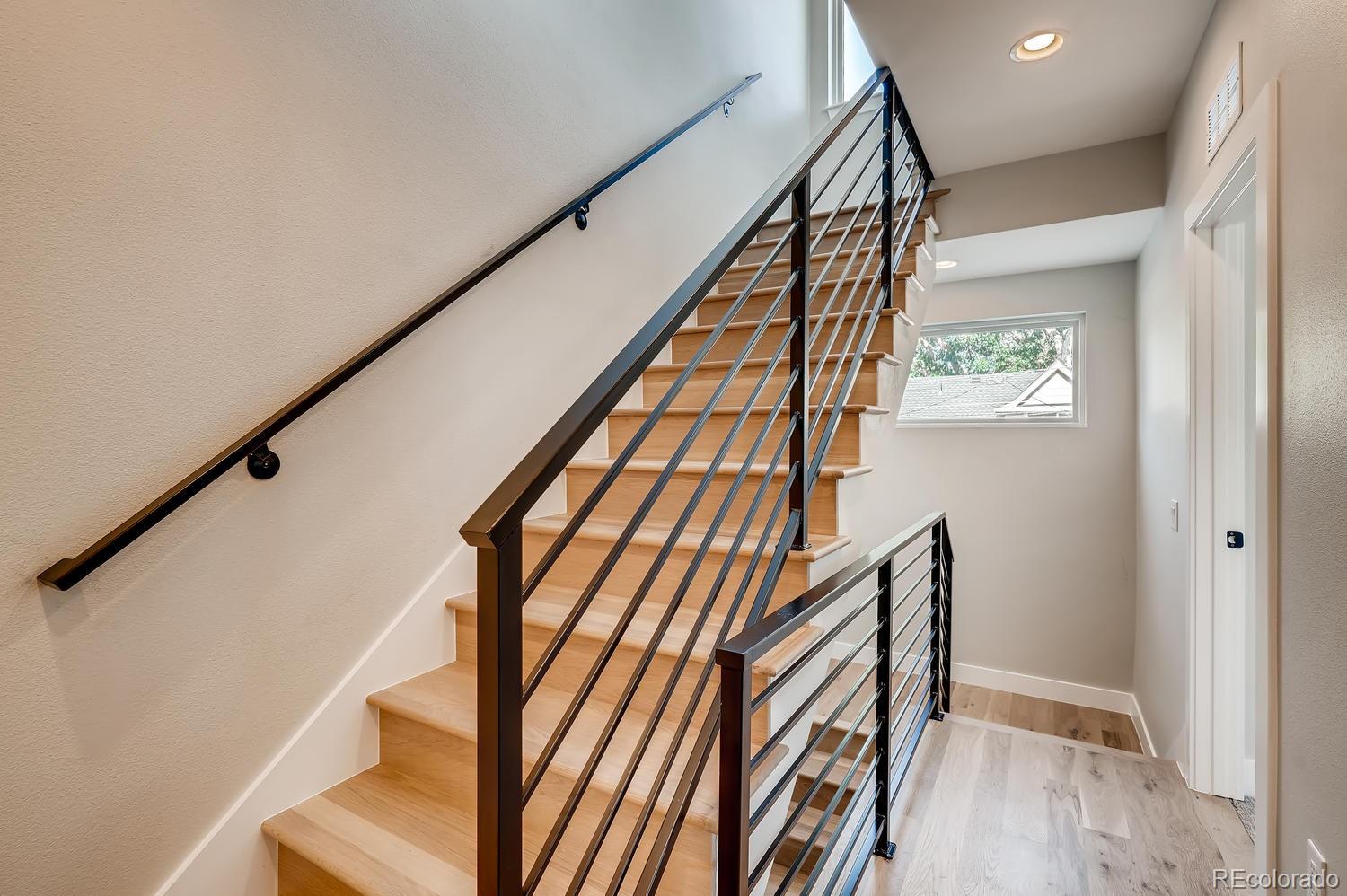 Get a Cash Offer Today 41 1385 Raleigh Stairwell with Iron Rails